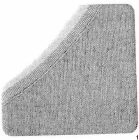 Close-up of a textured fabric surface with a diagonal seam, no visible text or symbols