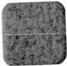 Close-up of a textured gray surface with no visible text, symbols, or markings.