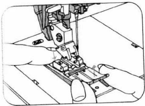 Illustration of hands operating a sewing machine needle (no text or symbols visible)