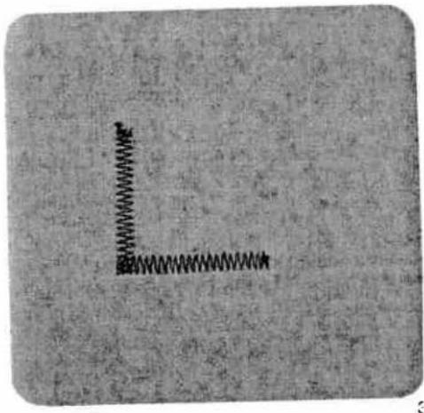 Close-up of a textured surface with a small vertical line and a horizontal line, no text or symbols visible.