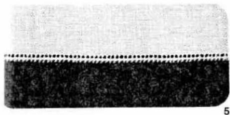 Close-up of a textured fabric with a dotted line above it, no visible text or symbols