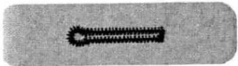 Close-up of a black, textured object resembling a stylized tool or device (no visible text or symbols)