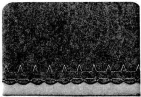 Close-up of a textured surface with repeating geometric patterns and a wavy base (no text or symbols)