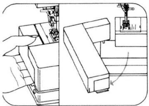 Technical line drawing of a sewing machine with hand operating the base panel (no text or symbols)