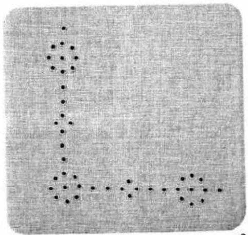 Abstract pattern of black dots arranged in a grid on a textured gray background (no text or symbols)