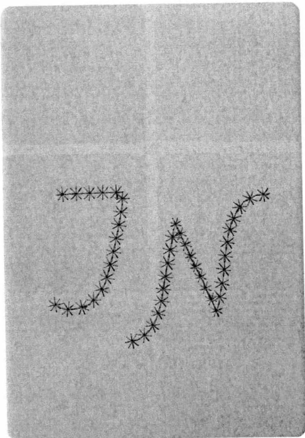 Abstract pattern of star-like shapes forming a zigzag line on textured background (no text or symbols)