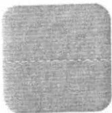 Close-up of a textured gray surface with no visible text, symbols, or markings