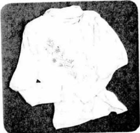 Black-and-white sketch of a traditional East Asian-style garment with floral patterns on the chest (no text or symbols)