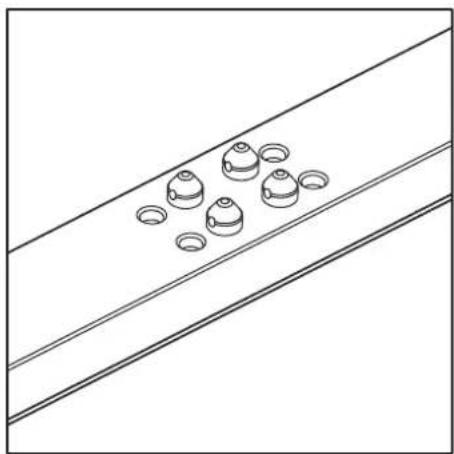 Diagram of a mechanical component with multiple holes and grooves, placed on a sloped surface (no text or symbols)