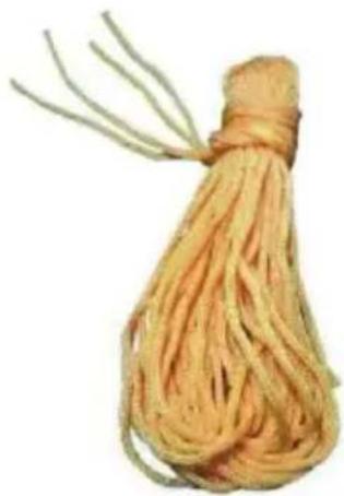 A bundle of yellow, textured food items tied with a thin bundle of white sticks (no text or symbols visible)