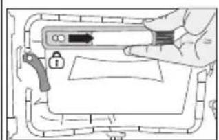 Diagram showing a hand holding a device with a lock and warning symbol, likely illustrating a safety or hazard control mechanism.
