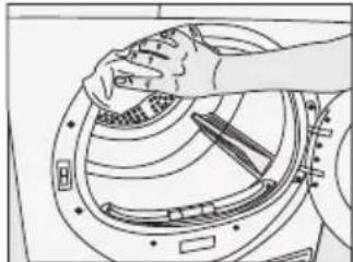 Line drawing of a hand cleaning a circular mechanical component (no text or symbols)
