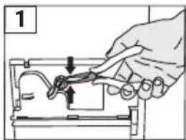 Hand holding a tool interacting with a device (no text or symbols visible)