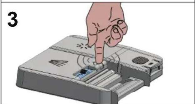 Hand inserting a device into a device with a magnifying glass (no text or symbols visible)