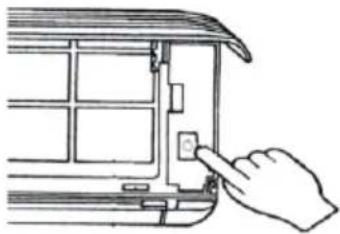 Hand inserting a component into a device panel (no text or symbols visible)