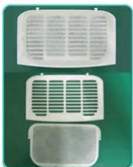 Three white rectangular electronic components with ventilation grilles, placed on a green background (no text or symbols visible)