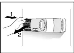 Diagram showing a hand holding a device with labeled parts 1 and 2, likely illustrating a mechanical or optical process.
