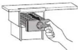 Hand inserting a small object into a box (no text or symbols visible)