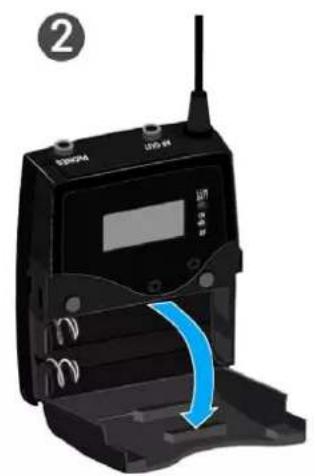 Close-up of a black electronic device with a blue arrow indicating a motion or force application (no text or symbols visible)