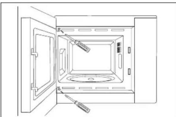 Line drawing of an open oven with a screwdriver inserted, showing internal components and no text or symbols.