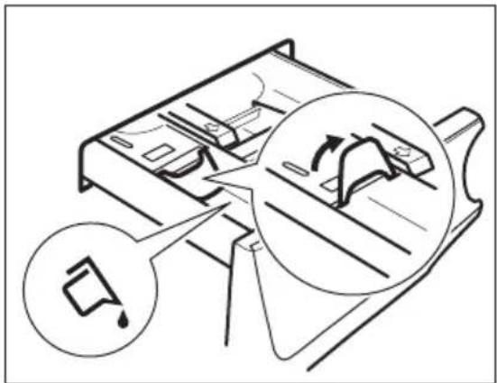 Diagram illustrating a mechanical or electrical component with labeled parts and directional arrows, including a magnified inset showing motion or flow.