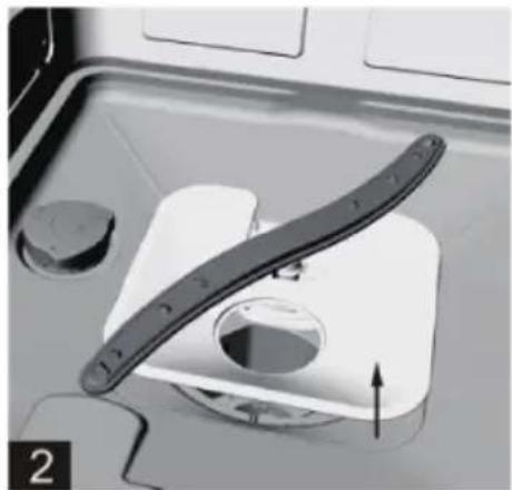 Close-up of a mechanical component with a curved blade and circular opening, no visible text or symbols