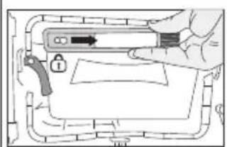 Diagram showing a hand holding a device with an arrow and lock, overlaid on a diagram of a mechanical or electrical component.