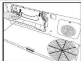 Technical line drawing of a device interior showing fan, ventilation ducts, and internal components (no text or symbols)