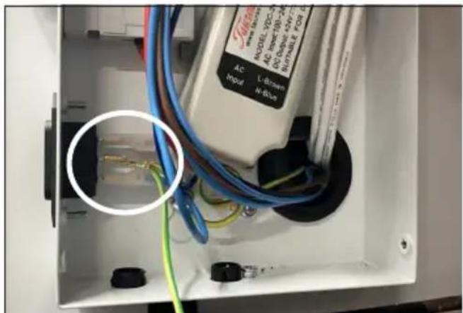 Interior view of an electrical enclosure showing wiring and components (no readable text or symbols)