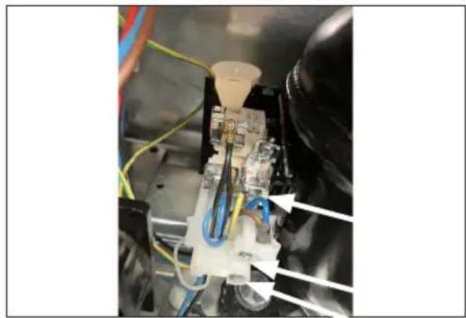 Close-up of a mechanical assembly with wires and components, no visible text or symbols
