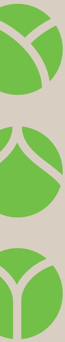 Three green abstract leaf-like shapes arranged vertically on a beige background (no text or symbols)