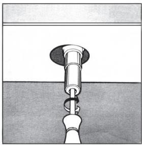 Illustration of a hand holding a cylindrical object inserted into a surface, with no visible text or symbols.