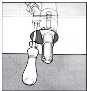Illustration of a hand holding a small mechanical component with a bulb and handle (no text or symbols)