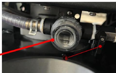 Close-up of a mechanical assembly with red annotation lines pointing to components (no readable text or symbols)