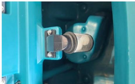 Close-up of a blue industrial component with a metallic connector and bolted joints (no visible text or symbols)