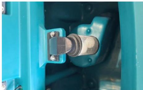 Close-up of a blue industrial component with a metallic connector and bolted joint (no visible text or symbols)