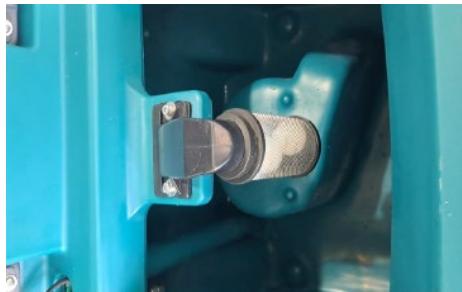 Close-up of a blue industrial component with a metallic connector and bolted joints (no visible text or symbols)