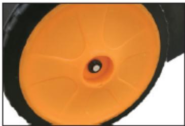 Close-up of a mechanical component with orange and black surfaces, no visible text or symbols
