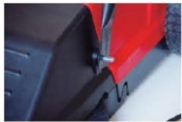 Close-up of a red and black vehicle wheel assembly with visible brackets and mounting holes (no text or symbols)