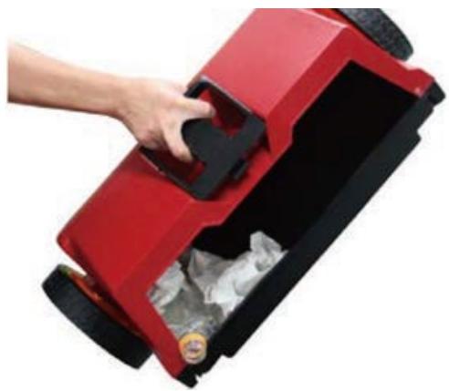 Hand placing a red plastic tray into a black container with ice cubes (no text or symbols visible)