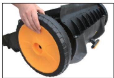 Close-up of a hand adjusting a black and orange industrial hose component (no text or symbols visible)