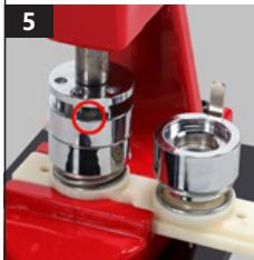 Close-up of a mechanical assembly with metallic components and a red outline highlighting a circular feature (no text or symbols visible)