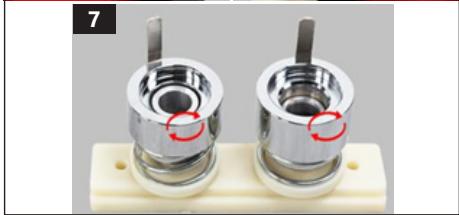 Close-up of two metallic cylindrical mechanical components mounted on a white base, with red circles highlighting features (no text or symbols visible)
