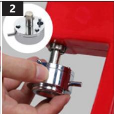Close-up of a hand holding a metallic mechanical component, with a magnified inset showing internal components (no text or symbols visible)
