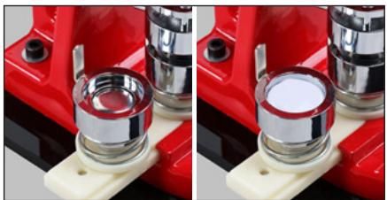 Close-up of a red mechanical component with metallic rings and mounting base (no visible text or symbols)