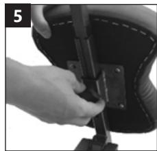 Close-up of a hand using a tool to adjust or install a black mechanical component on a dark ergonomic chair (no visible text or symbols)