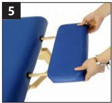 Close-up of a blue ergonomic chair with a hand adjusting its seat, no visible text or symbols