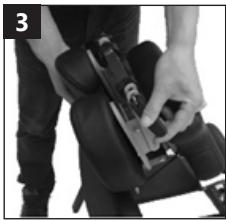 Person using a device to adjust or install a black seatbelt (no visible text or symbols)