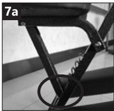 Close-up of a mechanical bracket with a circular detail, no visible text or symbols
