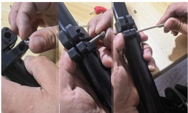 Close-up of hands assembling black mechanical components with a tool (no visible text or symbols)